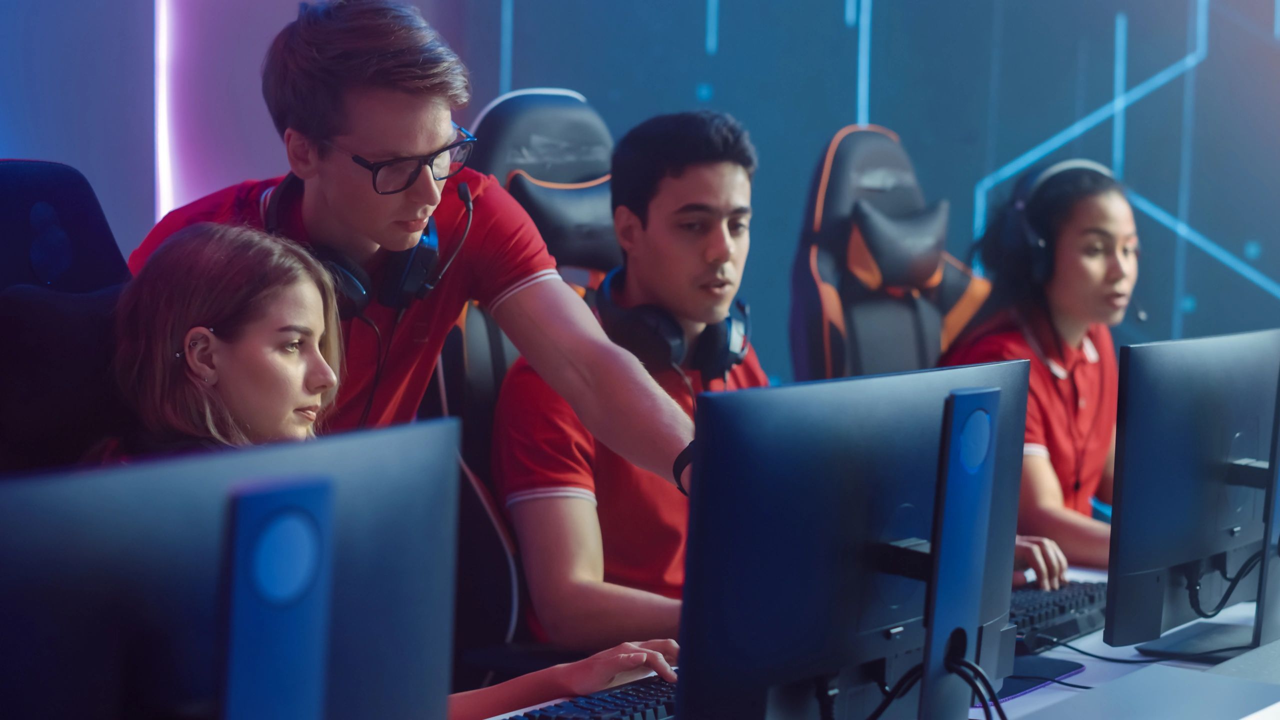 Esports team analyzing stats in real-time during a match.